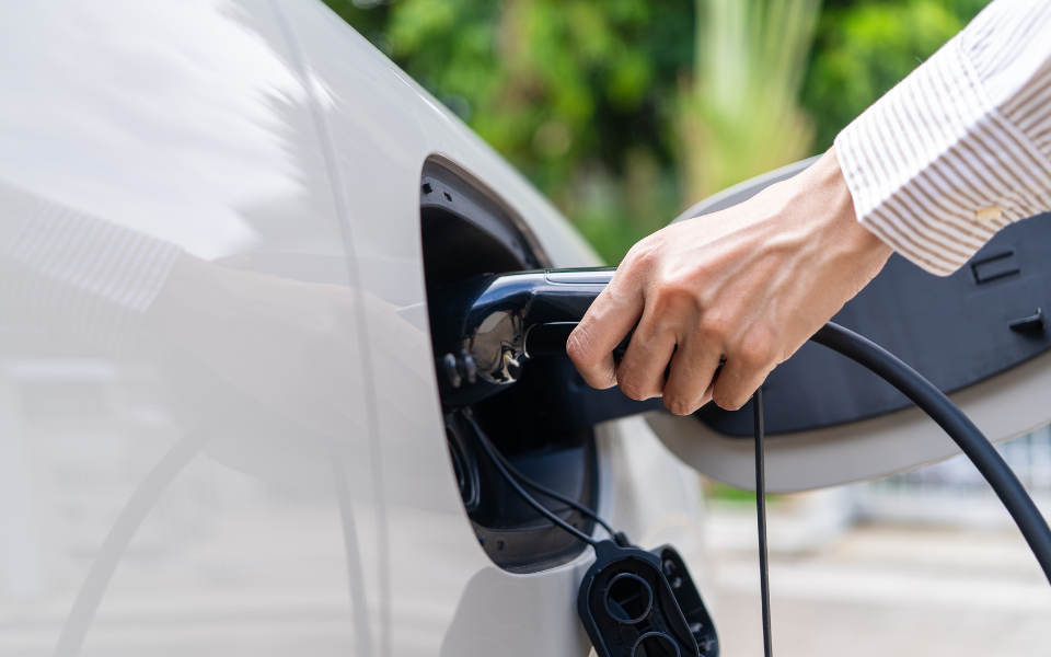 Car charger being plugged into car.