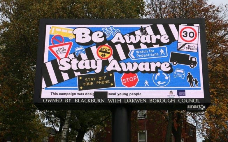 The poster Be Aware, Stay Aware on display in Blackburn can be seen during Road Safety Awareness Month
