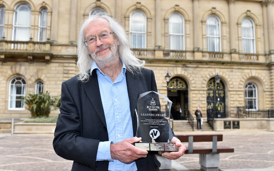 Leader of Blackburn with Darwen Borough Council, Cllr Phil Riley with the Leader’s Award trophy