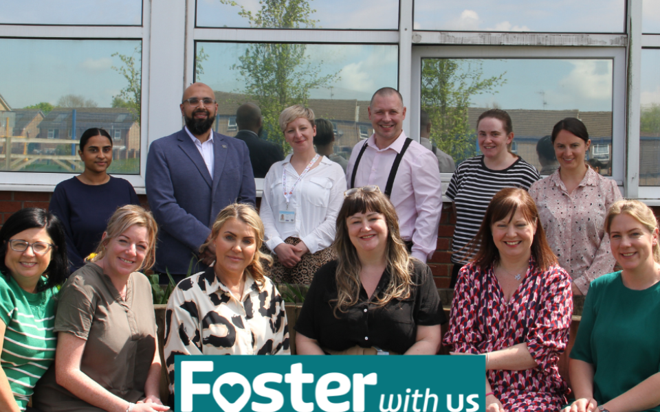 An image of a group of people with the Foster with Us logo