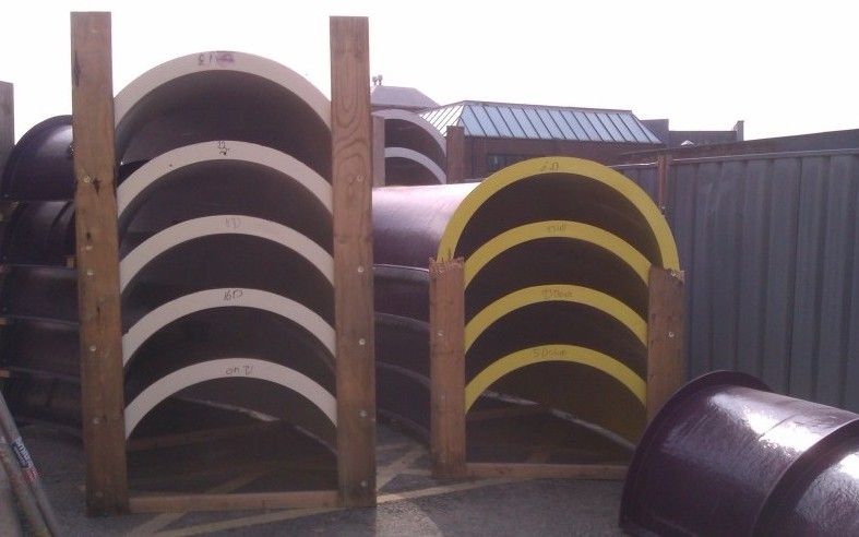 New flume sections waiting to be installed on the exterior of the building.