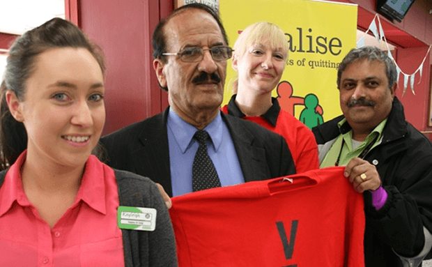 ​Councillor Mohammed Khan (centre) with stop smoking administrator Paula Dobson (centre right) and Asda workers Bharrat Palmer (right) and Kayleigh Wolfenden (left)